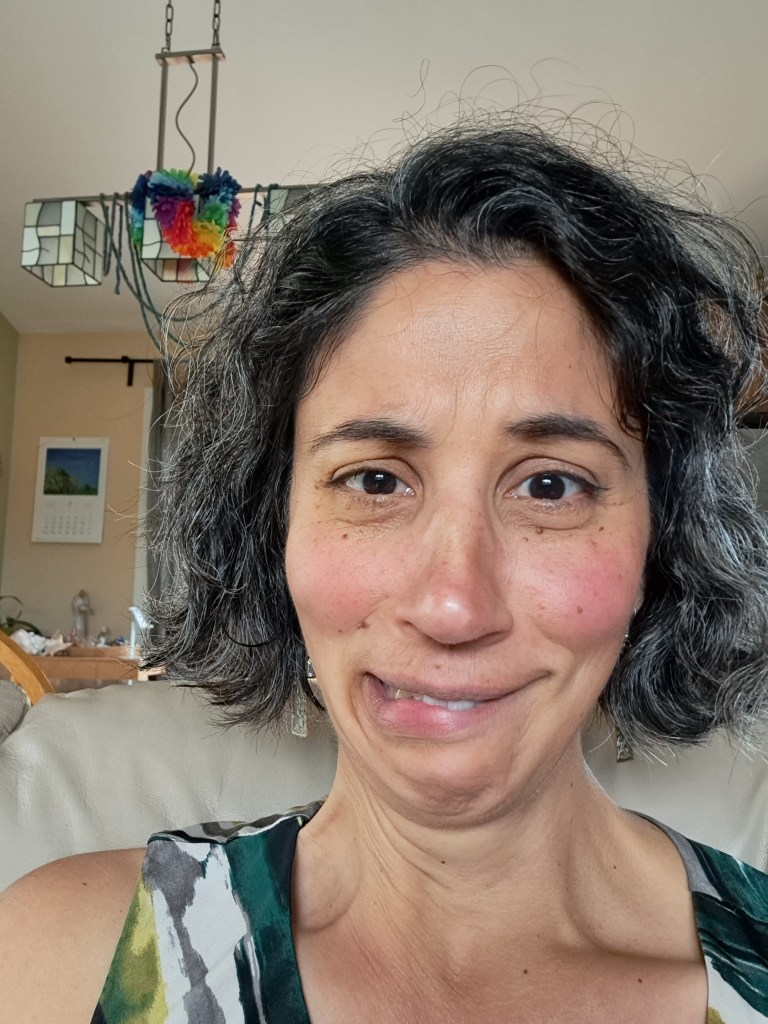 Me with an attempt at making an irritated look, with one eyebrow down and a frown.