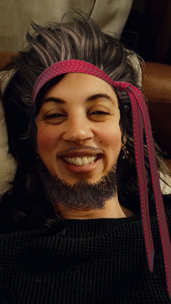 Bradlee with a beard and fake spiky hair.