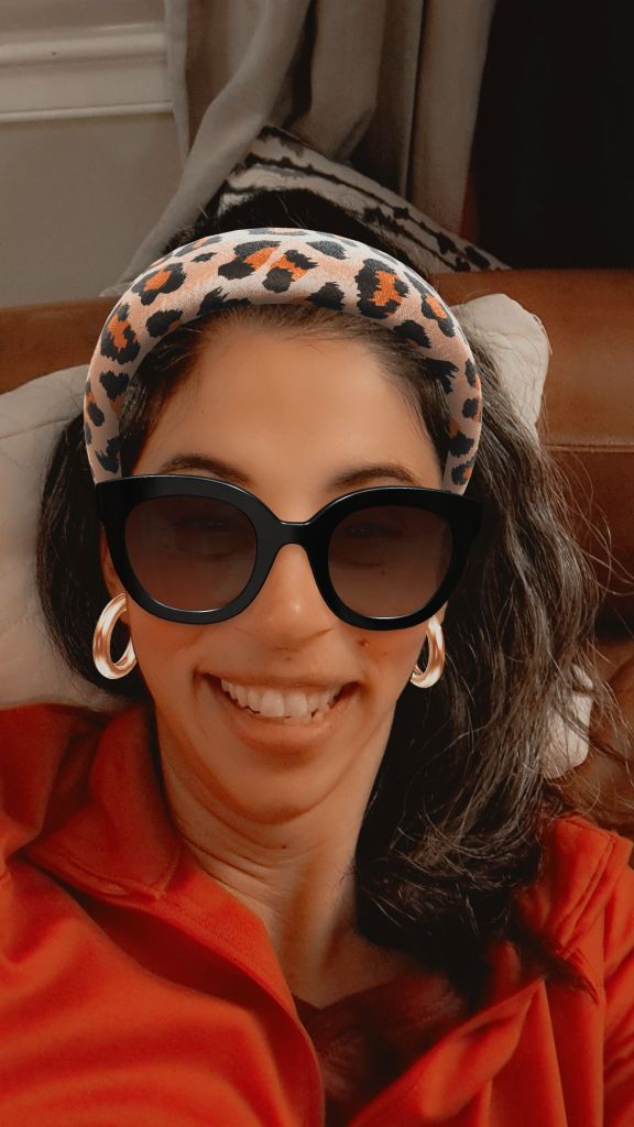 Bradlee with a leopard hair band, sunglasses and artificially smooth skin