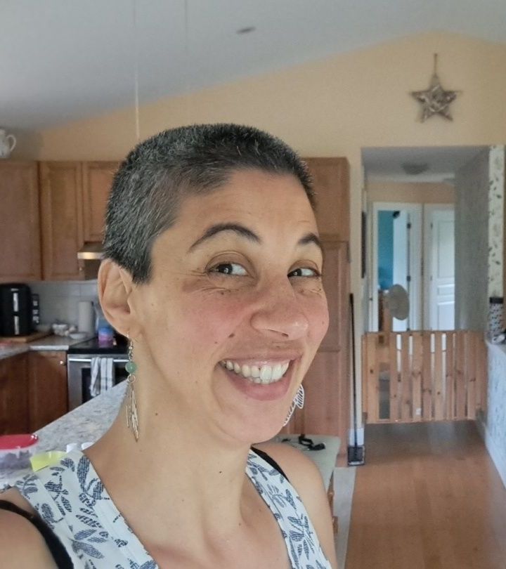 Bradlee with a shaved head and a big smile 
